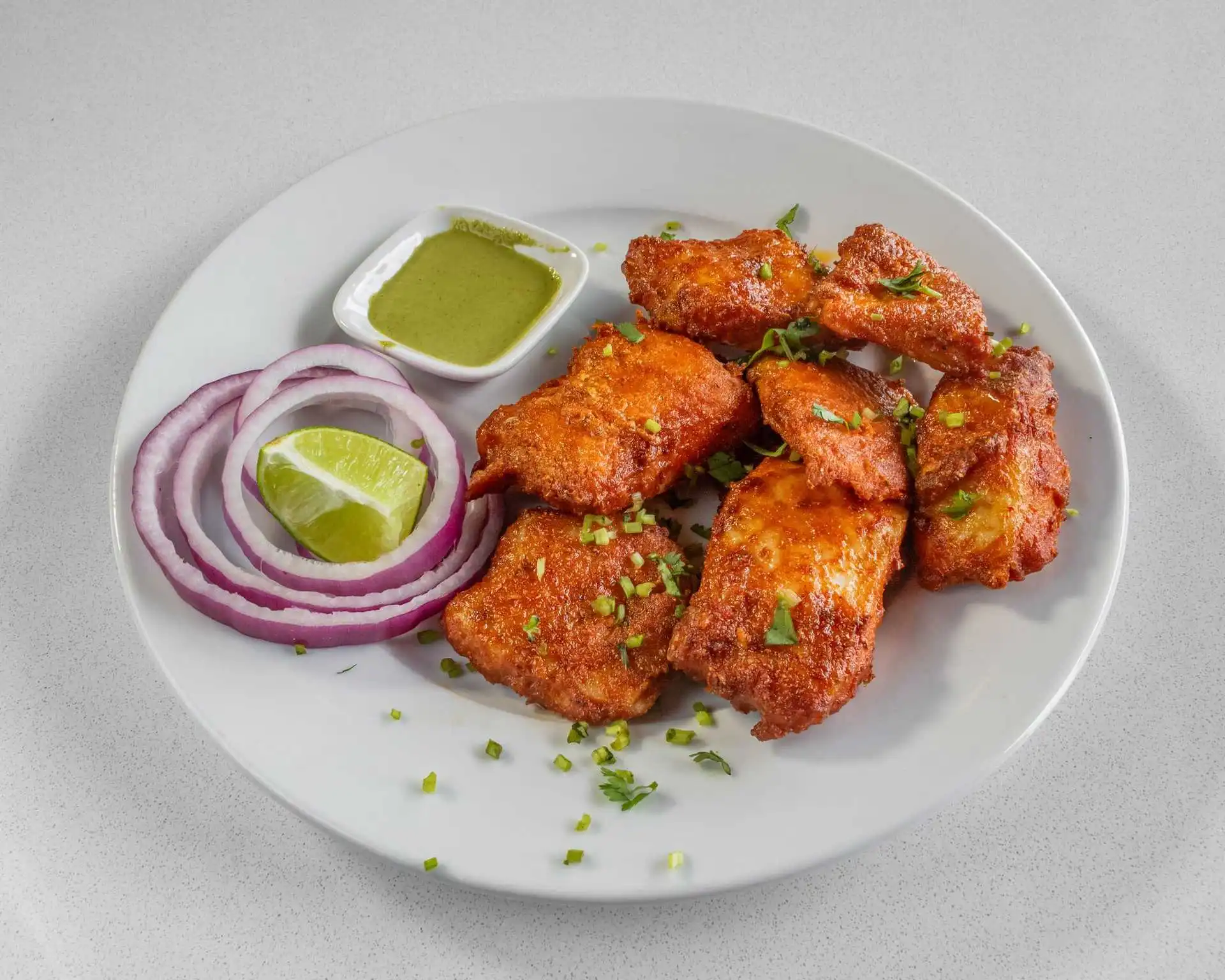 Crispy chicken wings at La Farina Winnipeg with chipotle and marinara sauce